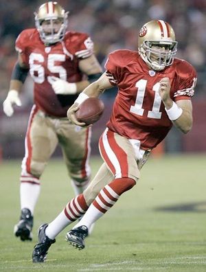 San Francisco 49ers QB Alex Smith (11) has his jersey pulled by