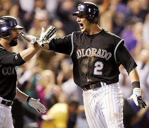 Colorado Rockies left fielder Matt Holliday celebrates after the National  League wild card tiebreaker game against the San Diego Padres at Coors  Field in Denver on October 1, 2007. Holliday scored the