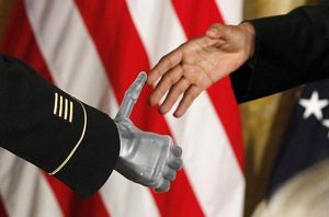 Army Sgt. 1st Class Leroy Arthur Petry applauds during a ceremony at the  White House in