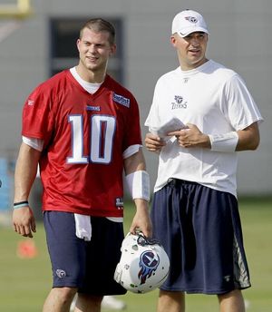 Tennessee Titans quarterback Jake Locker (10) hands off to Titans