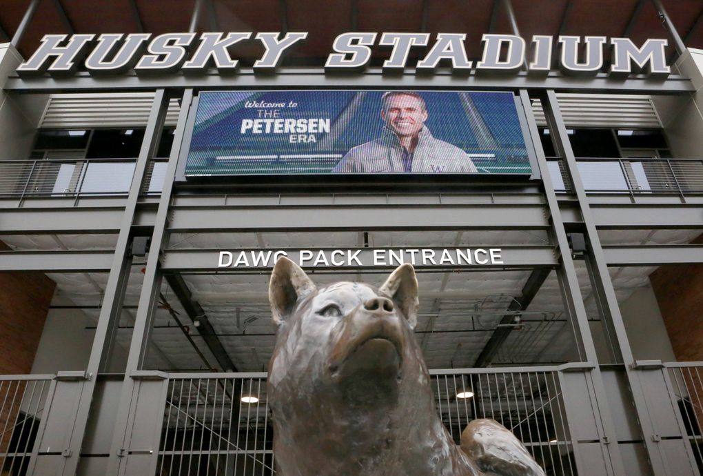 A jumbotron image of new University of Washington football coach Chris Petersen greets news media entering Husky Stadium for a news conference to introduced Petersen by athletic director Scott Woodward, Mon. Dec. 9, 2013, in Seattle.