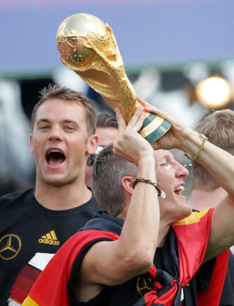 Manuel Neuer of Germany celebrates with World Cup trophy after