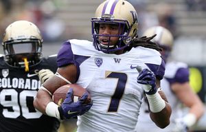 Washington running back Shaq Thompson, front, runs for touchdown past Colorado defensive lineman De’Jon Wilson in the first quarter of an NCAA college football game in Boulder, Colo., on Saturday, Nov. 1, 2014. (AP Photo/David Zalubowski) CODZ109