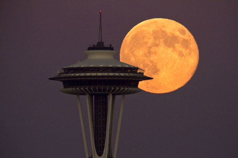 A super full moon rises besides the Space Needle Monday. This view is from the Ursula Judkins Viewpoint, part of Smith Cove Park, in Magnolia. The moonrise is not considered a technical “super moon” like the one that occurred this past June, but it is still closer than usual to the earth, making it appear larger than normal.