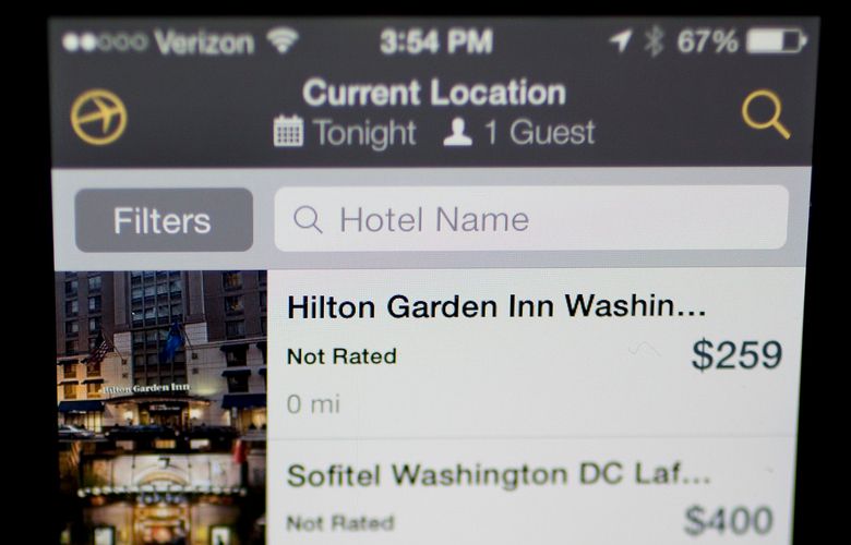 The Expedia Inc. application is displayed on an Apple Inc. iPhone in Washington, D.C., U.S., on Tuesday, Oct. 29, 2013. Expedia Inc. is expected to release earnings figures on Oct. 30. Photographer: Andrew Harrer/Bloomberg