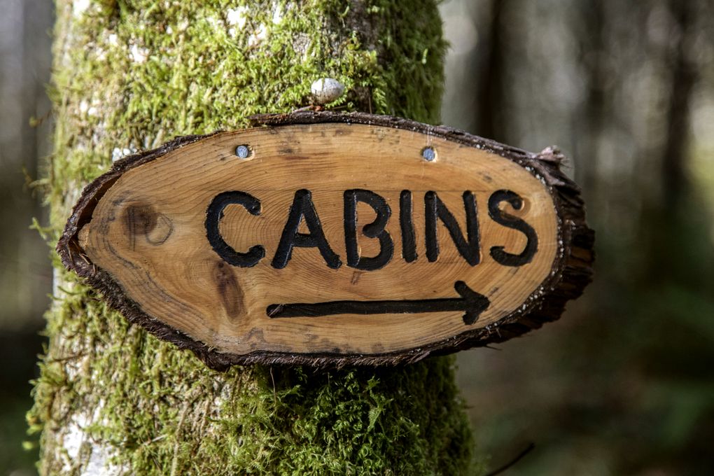 A Wellspring Spa sign lets visitors know where the cabins are located.
(Steve Ringman / The Seattle Times)