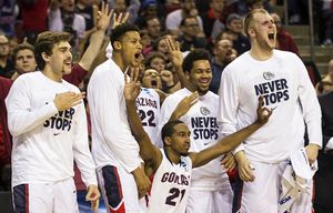 Gonzaga’s bench erupts when Kevin Pangos hits a 3-point shot, and is fouled in the process leading to a 4-point play Friday, March 20, 2015 at KeyArena in Seattle against NDSU.  The bucket gave the Zags a 71-62 lead with 5:44 to play