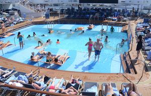 Royal Caribbean’s Quantum of the Seas, which often sails in chilly climates, has several swimming  pools, including two large ones that are indoors, and many large, busy whirlpools. The biggest outdoor pool includes a big screen showing videos and movies. (Christopher Reynolds/Los Angeles Times/TNS)