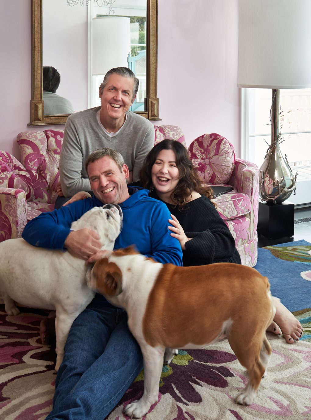 If it looks like a lovefest between homeowner (Bean and Donna Baxter) and builder (Marty Burns of Marty Burns Construction), that’s because it is. Even bulldogs Linus, left, and Veruca offer Burns an enthusiastic greeting. “It took a lot of really good people to bring this all together,” says Donna. (Benjamin Benschneider / The Seattle Times)