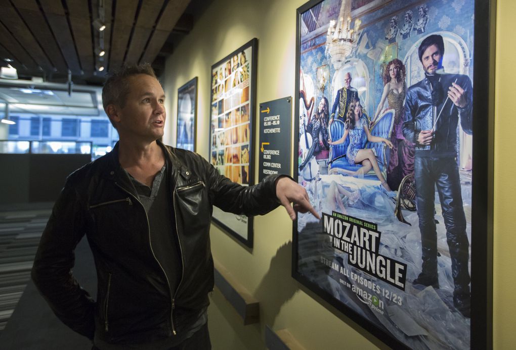 Amazon Studios head Roy Price explains a poster for the classical music-based TV drama “Mozart in the Jungle.” (Steve Ringman/The Seattle Times)