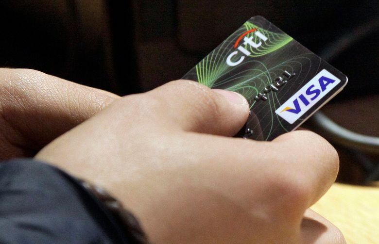 A Citi Visa credit card is tendered at opening of the Superdry store in New York’s Times Square.  (AP Photo/Richard Drew, File)