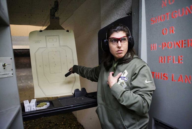 Amy Crawford was one of five Kirkland officers overexposed to lead in 2007 while training at the Issaquah police range, where the ventilation wasn’t working. “You literally couldn’t see one arm’s length in front of you,” she said. Here she shoots at an Everett range. (Lindsey Wasson / The Seattle Times)