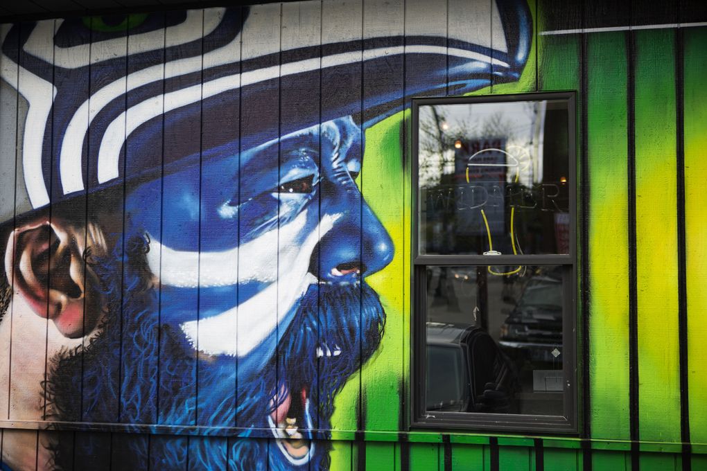 Some of mural artist Joey Nix’s work can be seen at The Hawks Nest Bar and Grill in the Sodo District. “I want a big wall where everyone’s going to see it, you know?” he said. (Lindsey Wasson/The Seattle Times)