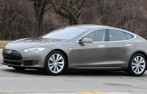 In a photo from Tuesday, April 7, 2015 in Detroit,  a Tesla Model S 70D is seen during a test drive. Electric car maker Tesla Motors is seeking mainstream luxury buyers by adding all-wheel-drive and more range and power to the base version of its only model. The added features for the base Model S come with about a 7 percent price increase to $75,000. Starting Wednesday, Tesla will stop selling the old base Model S called the 60 and replace it with the 70-D. The new car can go 240 miles per charge and from zero to 60 in 5.2 seconds. (AP Photo/Carlos Osorio)