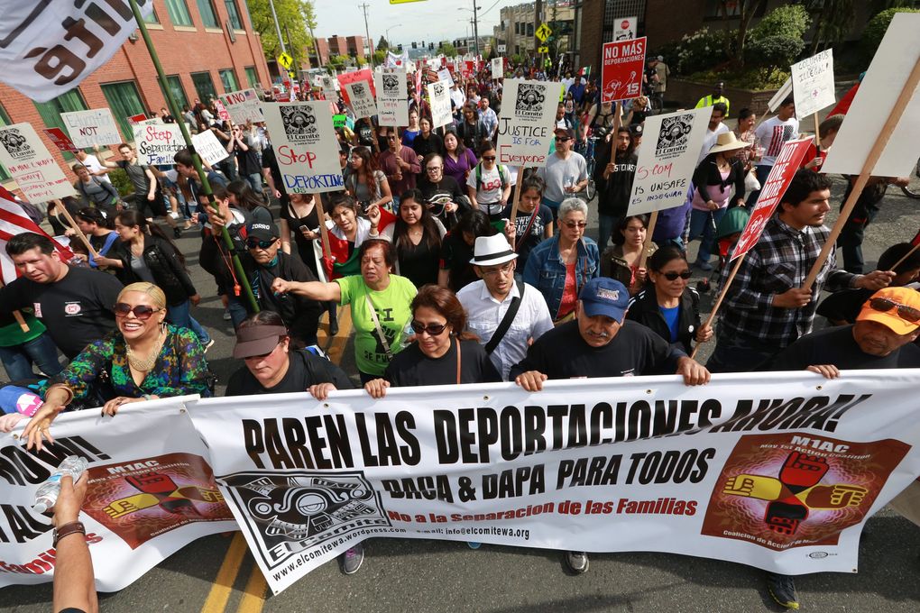 Protesters march at Boren Avenue and James Street on First Hill during the annual May Day march and rally for immigrant and workers rights, sponsored by El Comite and the May 1st Action Coalition. (Bettina Hansen / The Seattle Times)