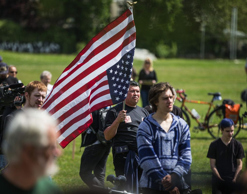 Antonio Diaz joins several hundred people at Judkins Park for the annual May Day Rally and March on Friday, May 1, 2015. (Dean Rutz / The Seattle Times)