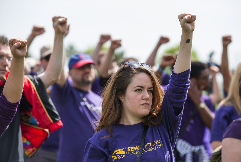 Amber Smith joins protesters Friday at Judkins Park. (Dean Rutz / The Seattle Times)