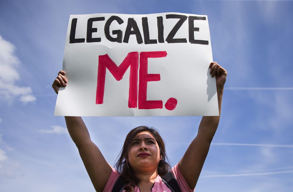 Diana Betancourt joins demonstrators at Judkins Park rallying over social justice issues, among them immigration. (Dean Rutz / The Seattle Times)