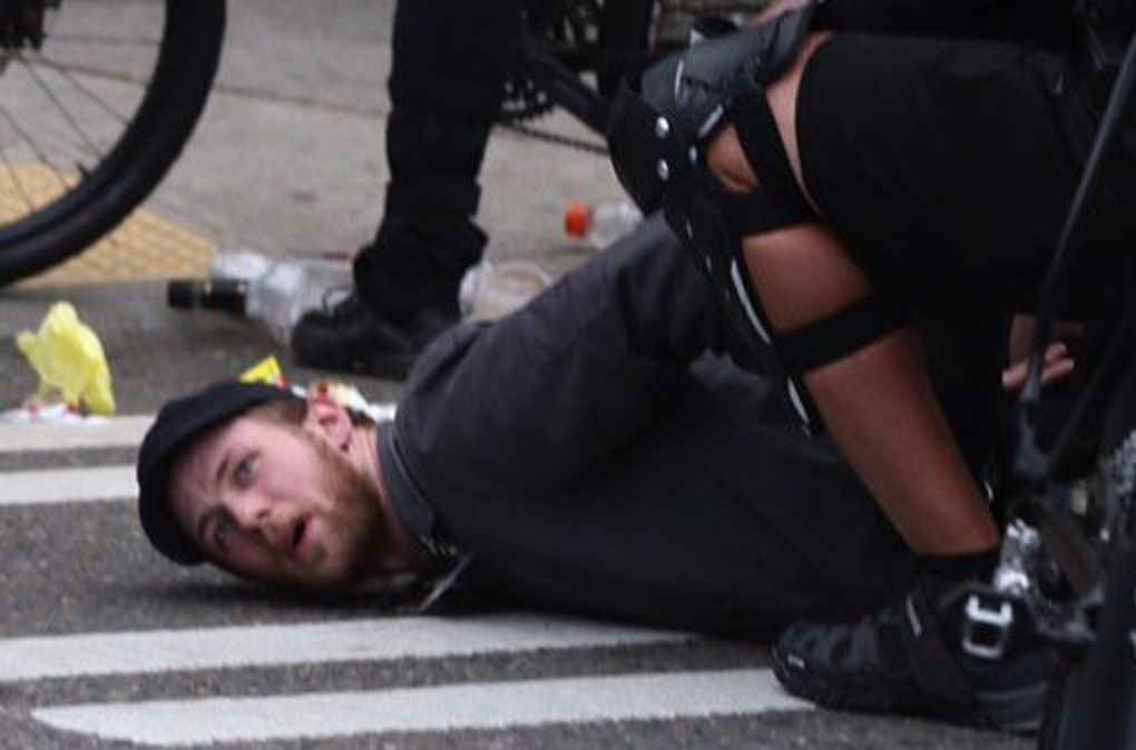 A protester is arrested near East Pike Street and Belmont Avenue on May 1, 2015, in the Capitol Hill neighborhood. (Bettina Hansen / The Seattle Times)