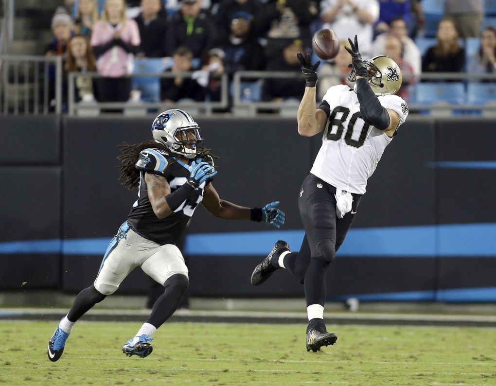 New Orleans Saints’ Jimmy Graham (80) hauls in a pass as Carolina Panthers’ Tre Boston (33) tries to defend during the second half of an NFL football game in Charlotte, N.C., Thursday, Oct. 30, 2014. The Saints won 28-10. (AP Photo/Bob Leverone) (Bob Leverone/AP)