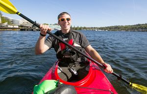 Solomon Wilson is one of the friendly faces you may see if you rent a kayak or paddleboard from Agua Verde Paddle Club in Seattle Thursday April 16, 2015.