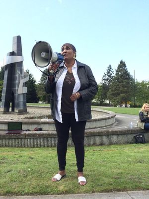 Speaker Deborah Jackson addresses a crowd of about 100 at a “Black Lives Matter” rally at Martin Luther King Jr. Memorial Park. (Christine Clarridge / The Seattle Times)