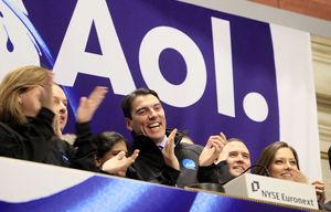 FILE – In this Dec. 10, 2009 file photo, AOL Chairman and CEO Tim Armstrong, center, applauds during opening bell ceremonies of the New York Stock Exchange. Verizon on Tuesday, May 12, 2015 announced it is buying AOL for about $4.4 billion, advancing the telecom’s push in both mobile and advertising fields. (AP Photo/Richard Drew, File) NYBZ144