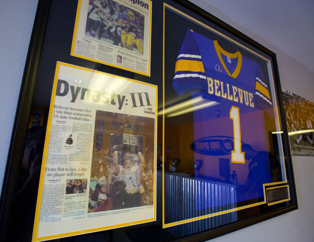 Framed memorabilia of Tracy Ford, from his playing days at Bellevue High School, hangs in the lobby at Ford Sports Performance. After helping Bellevue win a state title, Ford went on to play at the University of Idaho and Portland State University. (MIke Siegel/The Seattle Times)
