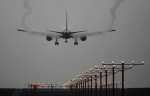 A plane lands at SeaTac International Airport. (Ellen M. Banner / The Seattle Times)