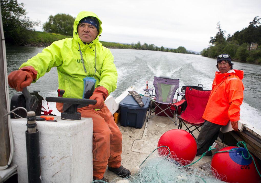 Swinomish Chairman Brian Cladoosby, left, guides his 21-foot boat during a fishing day with his brother Marty Cladoosby on the Skagit River’s North Fork. (Bettina Hansen / The Seattle Times)