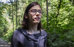 Pixie Serigala who’s homeless and transgender walks in Cowen Park to a spot she calls Druid Rock 
that she hangs out on to reduce stress and be close to nature.