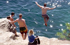 Jumping from the rocks at Tubbs Hill in Coeur d’Alene, Idaho. (Josh Noel/Chicago Tribune)