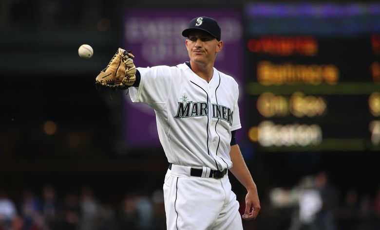 Seattle Mariners' Jake Lamb runs to first base during a baseball