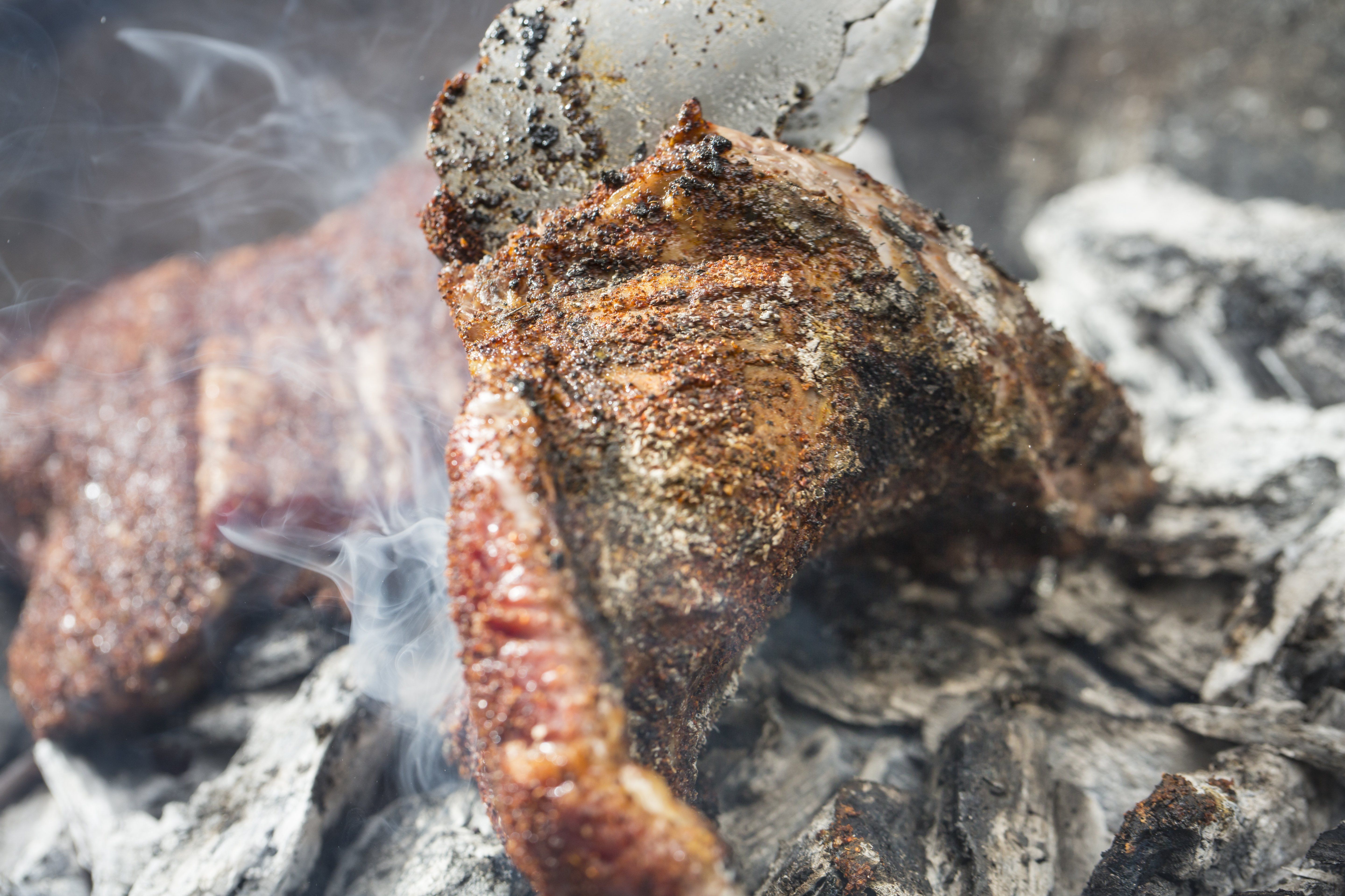 Cooking steak shop on coals