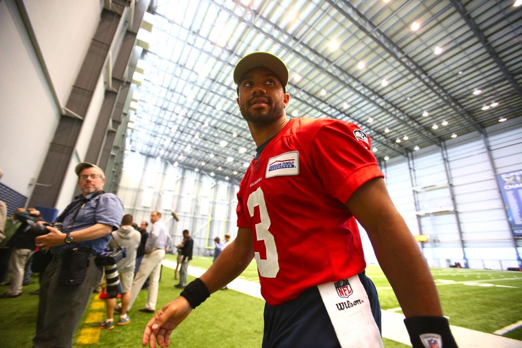 Seahawks QB Russell Wilson leaves after addressing the media after organized team activities at the Virginia Mason Athletic Center on June 2. (John Lok / The Seattle Times)