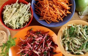 Clockwise form top left: Kohlrabi Slaw with Creamy Avocado, Carrot Slaw with Miso Vinegarette, Shaved Fennel with Arugula Crunch Salad, and Raw Beet Salad with Fennel. (Michael Tercha/Chicago Tribune/TNS)