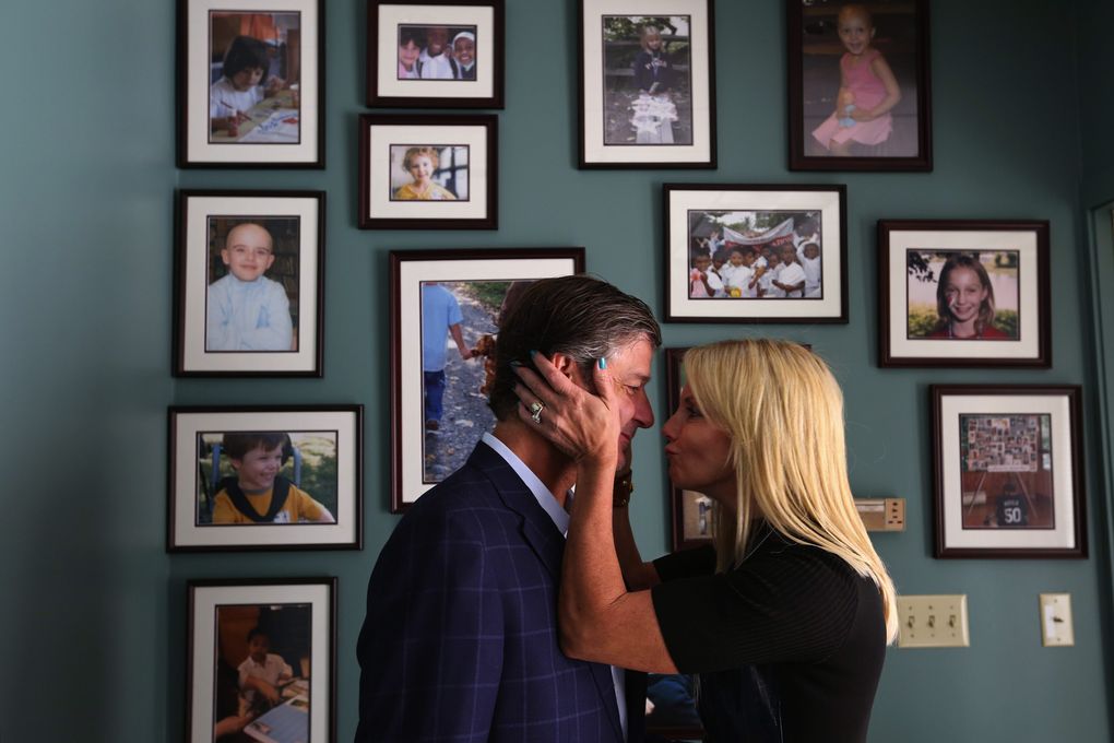 Former Seattle Mariners pitcher Jamie Moyer and his wife Karen, at their foundation’s Magnolia headquarters, Thurs., Aug. 6, 2015, in Seattle. The Moyer Foundation has made Jamie a beloved Seattle athlete as much as what he did on the field. In the background are pictures of children benefiting from the foundation over the years. (Ken Lambert / The Seattle Times)