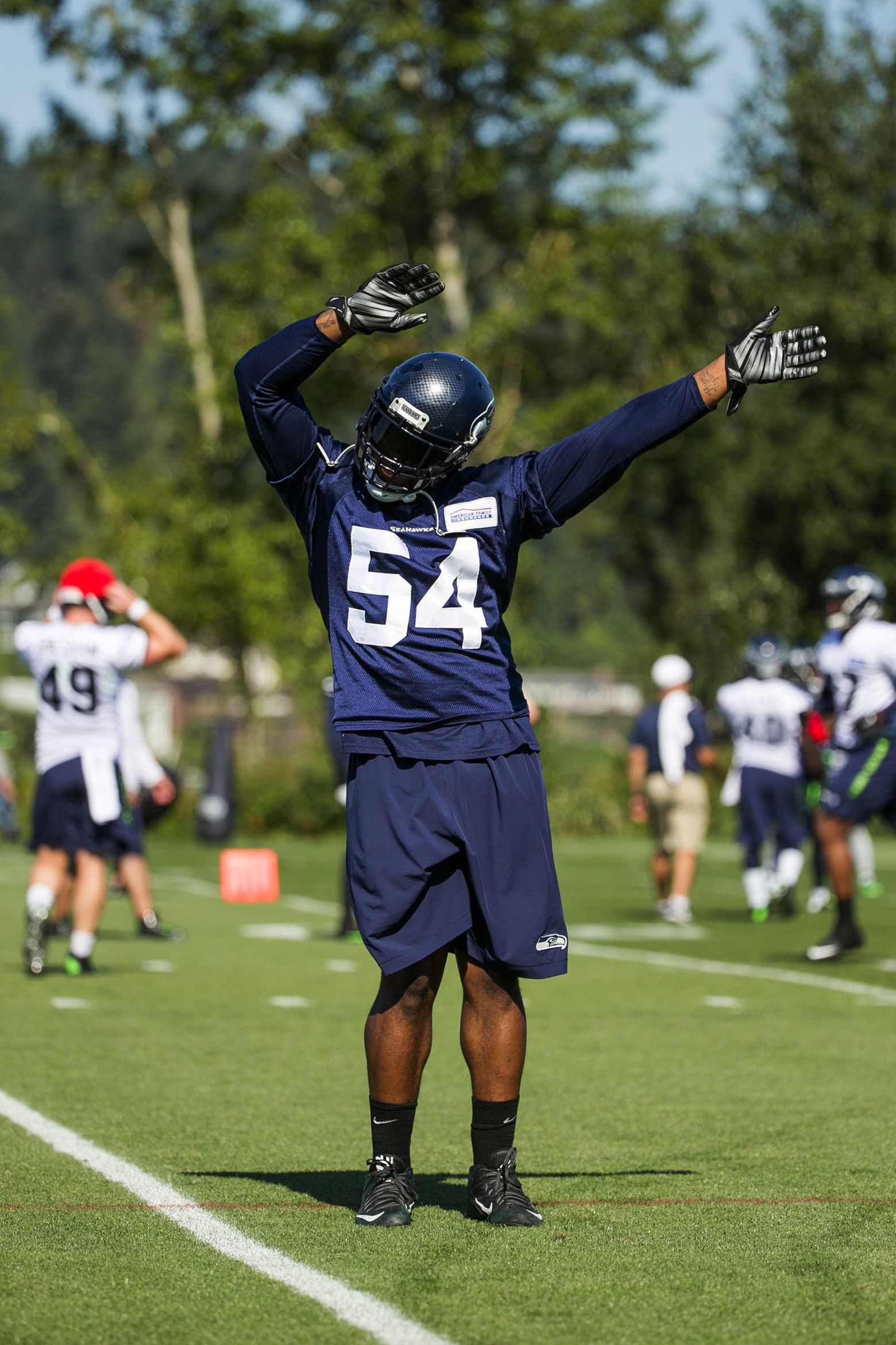 Former Seahawks player Marcus Trufant skydives into training camp