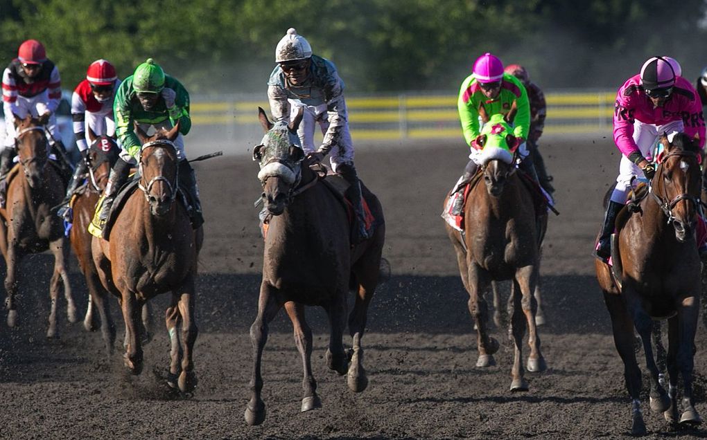 Leslie Mawing, center, rides Stryker Phd to victory in the Longacres Mile at Emerald Downs on Aug. 16, 2015. (Ellen M. Banner / The Seattle Times)