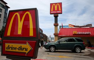 SAN FRANCISCO, CA – JULY 22: A car pulls out of the parking lot at a McDonald’s restaurant on July 22, 2013 in San Francisco, California. McDonald’s stock slipped in Monday trading after the fast food giant missed analyst expectations for second-quarter earnings with profits of $1.4 billion, or $1.38 a share compared to $1.35 billion, or $1.32 a share, one year ago. (Photo by Justin Sullivan/Getty Images)