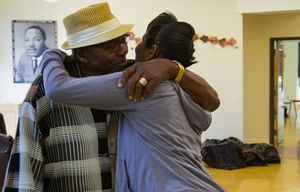Bishop Eugene Drayton, who helped open Zion Prep  in 1982, gets a hug from Yolanda Allen at the school as Lois Vaughn looks on Thursday morning, August 27, 2015.  The women were at the school, helping pack  because the school is closing.  Drayton was coming in to visit his son-in-law, Rev. Doug Wheeler, who also helped open the school and has been the director on and off since it opened.