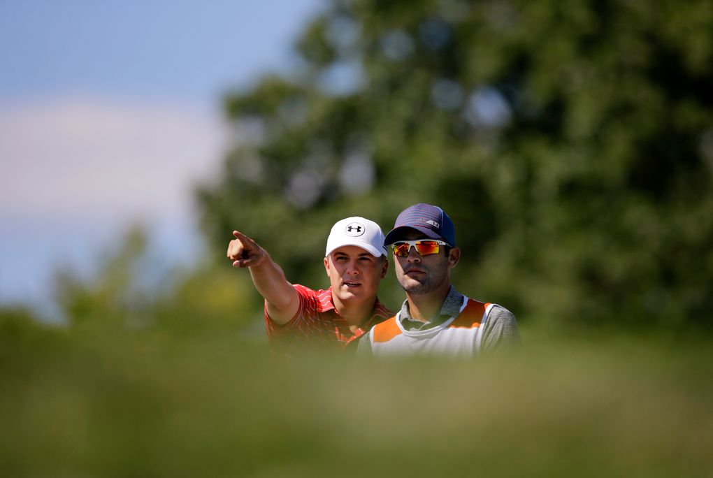 Jordan Spieth stands with his caddie, Mike Greller, on the seventh hole during the second round of play at The Barclays golf tournament Friday, Aug. 28, 2015, in Edison, N.J. (AP Photo/Mel Evans)
