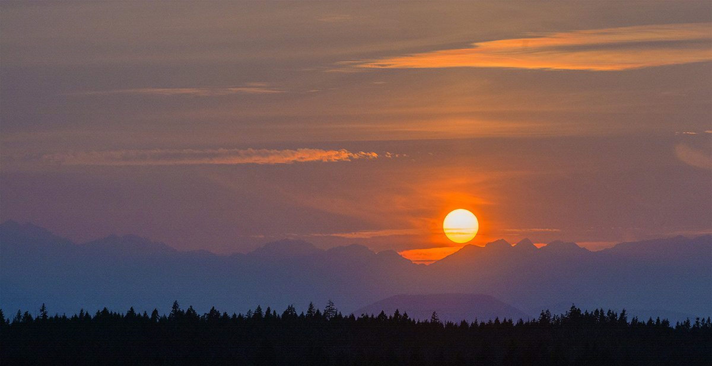 Smoky sunset on the Olympics | The Seattle Times