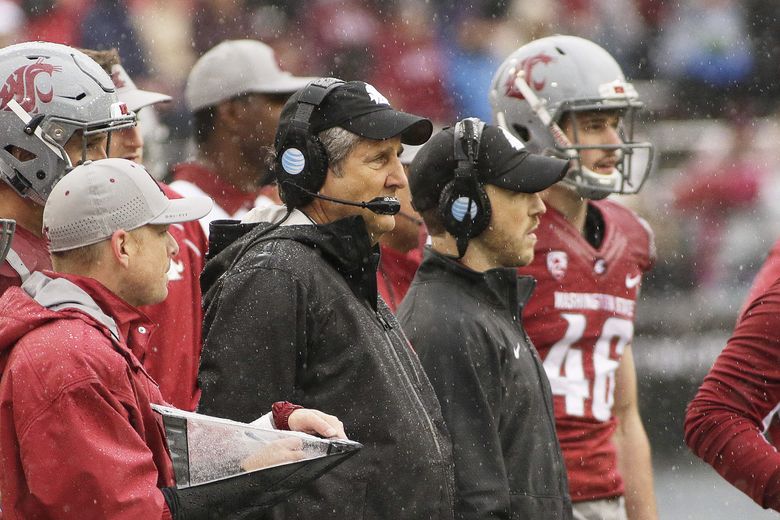 Washington State head coach Mike Leach, second from the left, watches during the first half of an NCAA college football game against Portland State, Saturday, Sept. 5, 2015, in Pullman, Wash. (AP Photo/Young Kwak) 