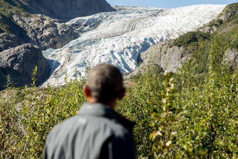 President Barack Obama pauses to view the Exit Glacier in Seward, Alaska, Tuesday, Sept. 1, 2015, which according to National Park Service research, has retreated approximately 1.25 miles over the past 200 years. Obama is on a historic three-day trip to Alaska aimed at showing solidarity with a state often overlooked by Washington, while using its glorious but changing landscape as an urgent call to action on climate change. (AP Photo/Andrew Harnik)
