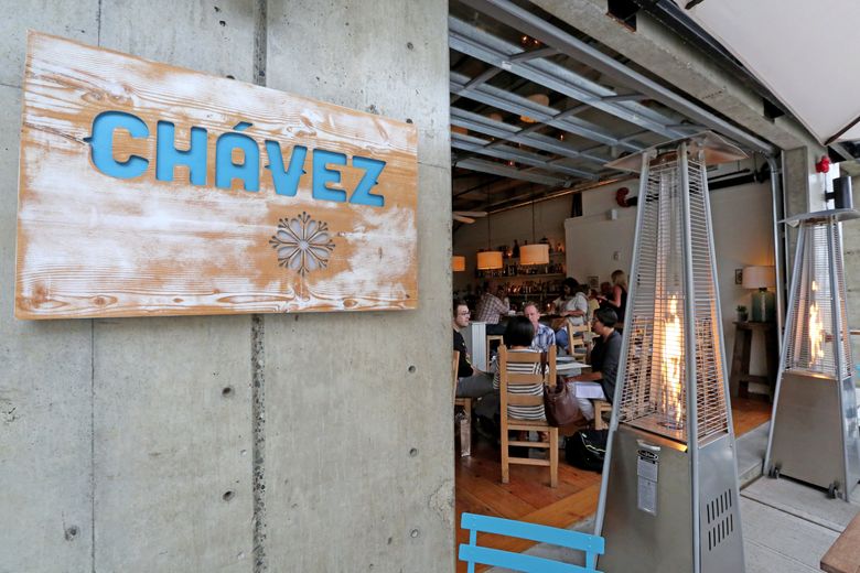 Patio heaters warm the outdoor-dining space at Chavez. (Greg Gilbert/The Seattle Times)