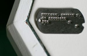 A copy of Donald Hallman’s Army dog tag — he burned all other records of his service after his was discharged for being a Ă’Class II homosexual” — at his home in Columbus, Ohio, Aug. 23, 2015. Hallman is one of a steady march of older veterans who were kicked out of the military decades ago for being gay, and now asking that their less-than-honorable discharges be upgraded. (Andrew Spear/The New York Times)