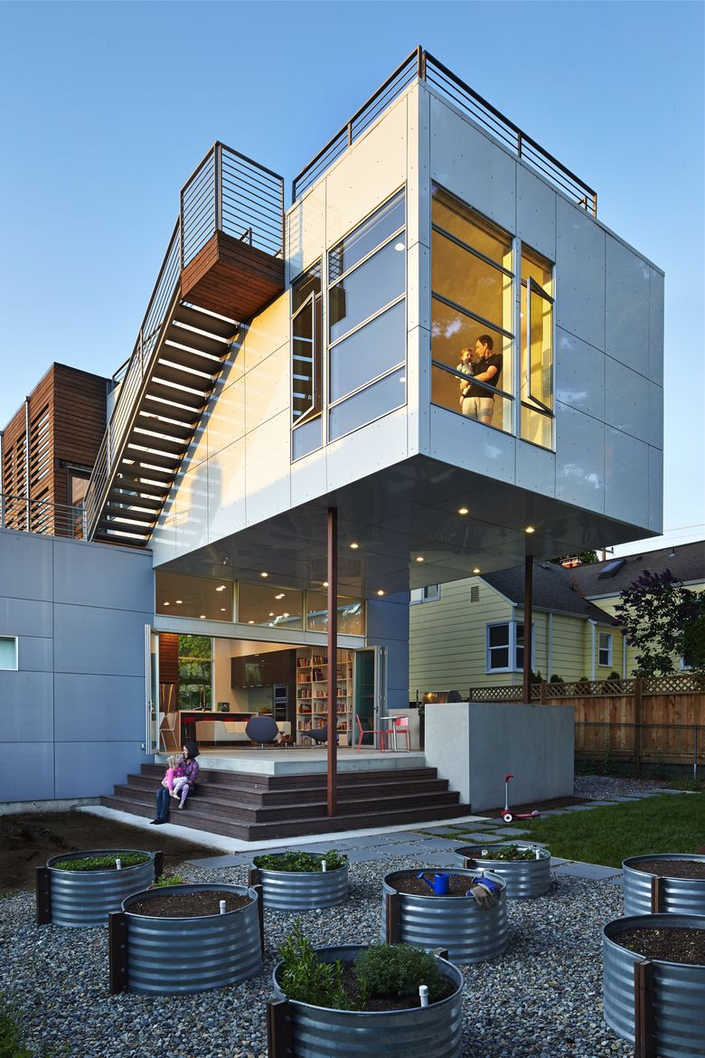 Homeowners Dave Grimes and Sunny Knott found a house they could afford, and turned it into their dream family home. (Benjamin Benschneider / The Seattle Times)