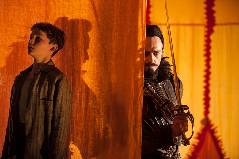 Levi Miller, left, and Hugh Jackman in “Pan.” (Laurie Sparham)