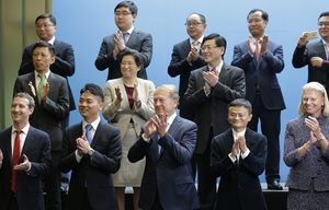 A group of CEOs and other executives applaud as Chinese President Xi Jinping (not shown) arrives to greet them and pose for a photo at Microsoft’s main campus in Redmond, Wash., Wednesday, Sept. 23, 2015. Included in the group are (front row, left to right) Mark Zuckerberg, chief executive of Facebook, Liu Qiangdong, co-founder of JD.com, Cisco CEO John Chambers, Alibaba Executive Chairman Jack Ma, and IBM CEO Ginni Rometty.  (AP Photo/Ted S. Warren, Pool) WATW205